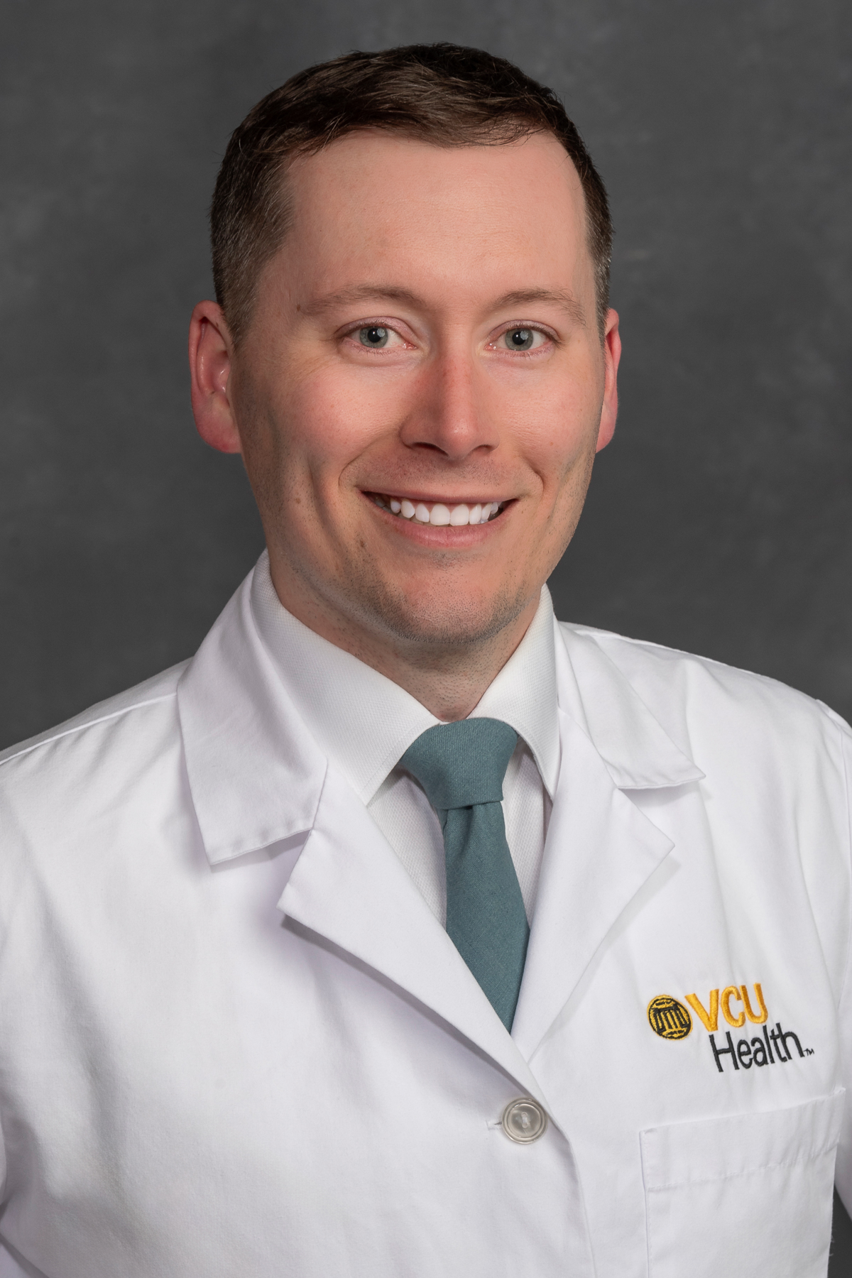 James Carr, D.O. in white coat