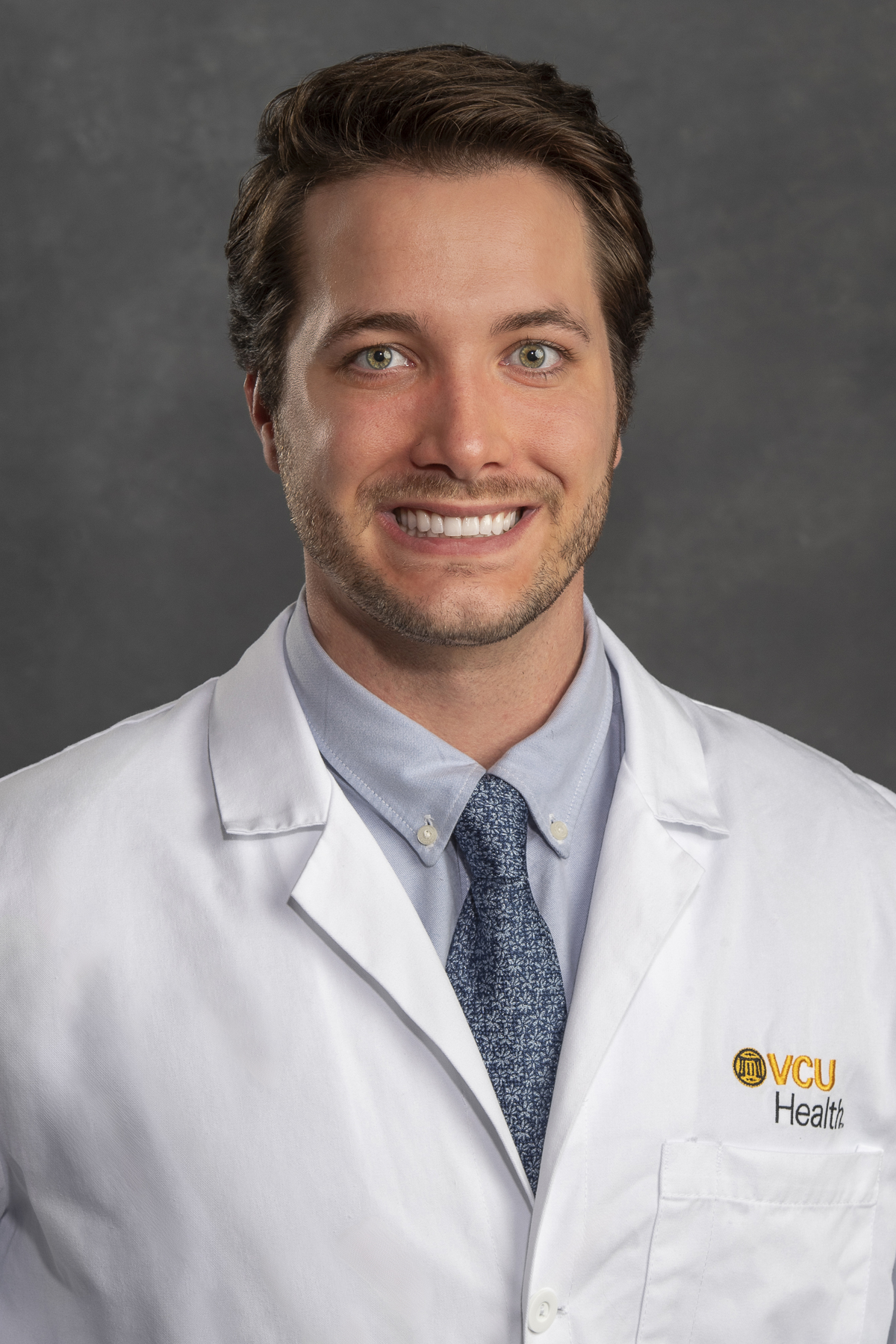 Reed Pierce, D.O. in white coat